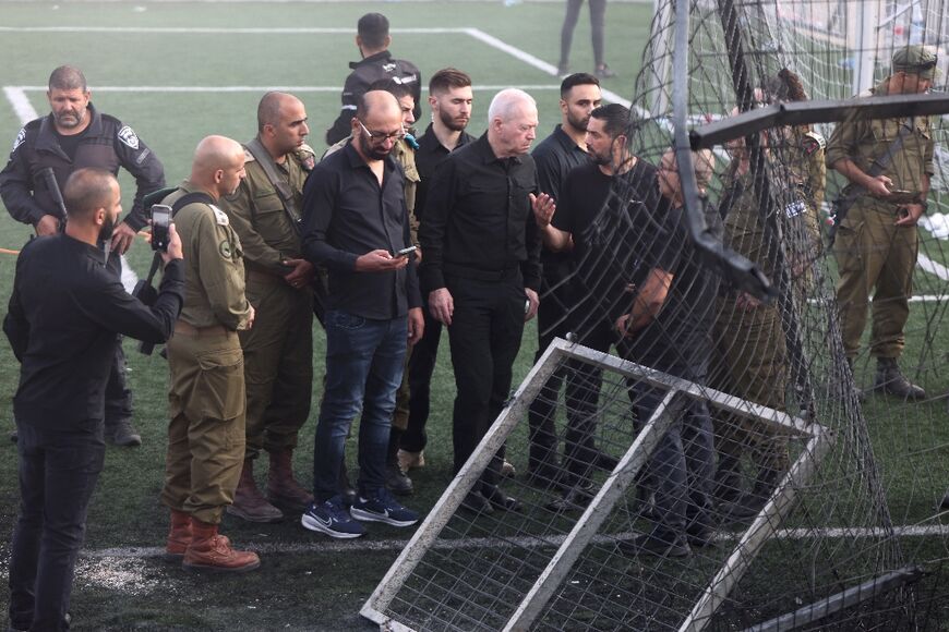 Israeli Defence Minister Yoav Gallant visited the site of the rocket strike, which the army said killed 12 young people at a football pitch
