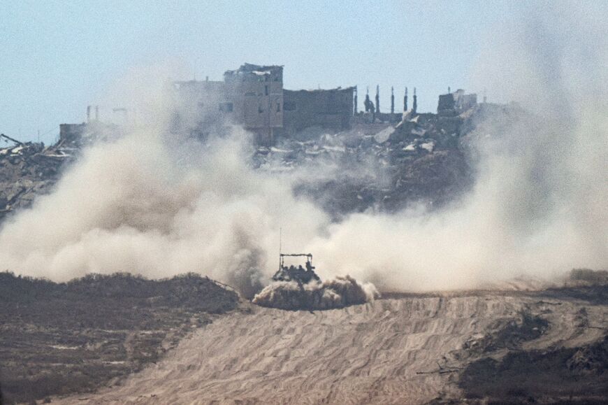 An Israeli tank moves along Israel's southern border with Gaza 