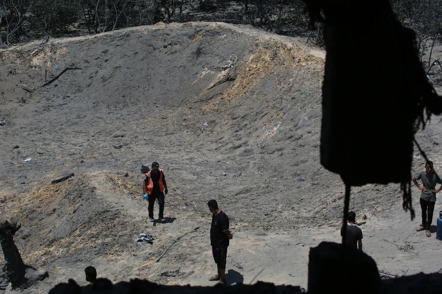 An crater was left by an Israeli military strike at the Al Mawasi camp for displaced people