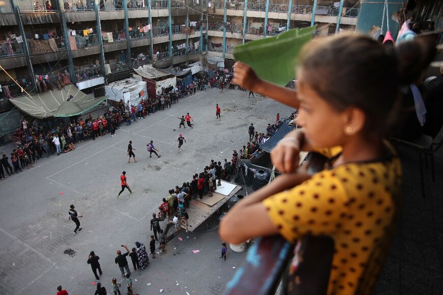 In the courtyard of a displaced persons shelter in north Gaza's Jabalia, two football clubs squared off