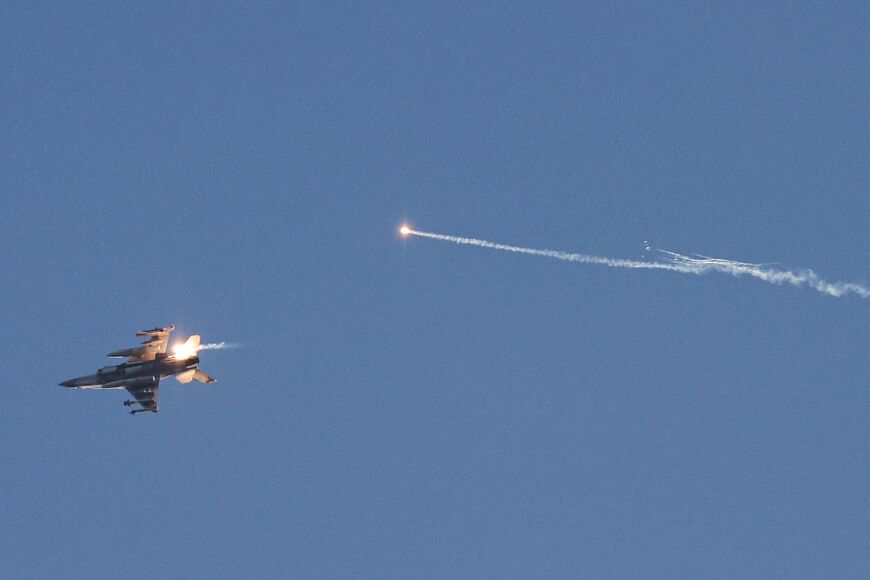 An Israeli fighter jet firing flares as it flies to intercept a hostile aircraft launched from Lebanon