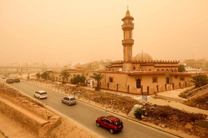 Motorists drove through a sandstorm in Libya's eastern city of Benghazi in April 2024