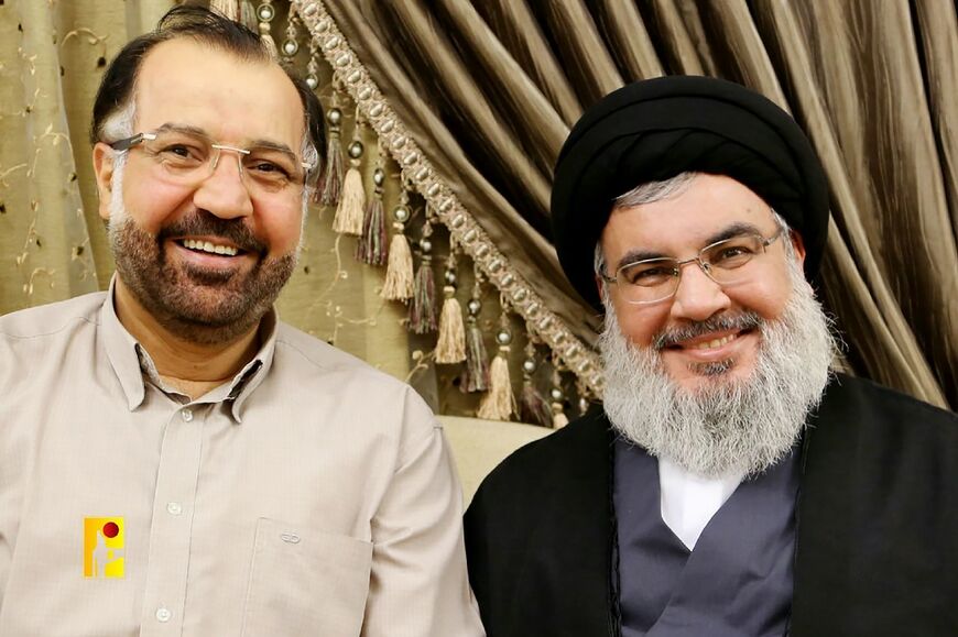 An undated handout photo released by Hezbollah on July 31, 2024, shows Hezbollah chief Hassan Nasrallah (R) and top Hezbollah commander Fuad Shukr (L), who was killed in an Israeli strike in Beirut