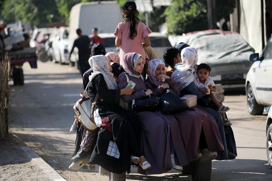 Palestinians flee Deir al-Balah in the central Gaza Strip following Israel's latest evacuation orders