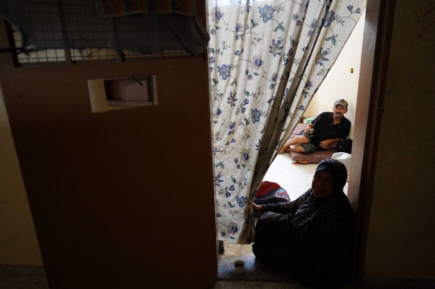 Palestinians in a southern Gaza prison now used as a displacement shelter