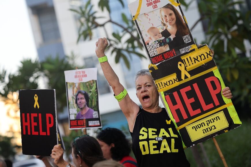 Supporters of the Israeli hostages held in Gaza rally in Tel Aviv during Blinken's visit to demand a deal to bring them home