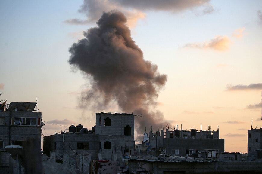 Smoke rises as Israeli troops target a building in Nuseirat refugee camp, central Gaza