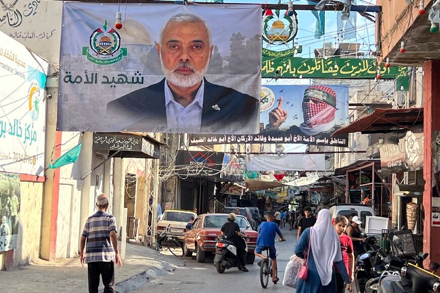 A banner bearing the picture of slain Hamas leader Ismail Haniyeh in the Palestinian refugee camp of Ain al-Hilweh in Lebanon