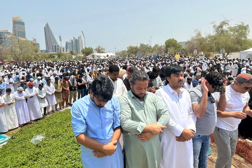Muslims pray near a mosque in Doha during the funeral of Hamas leader Ismail Haniyeh