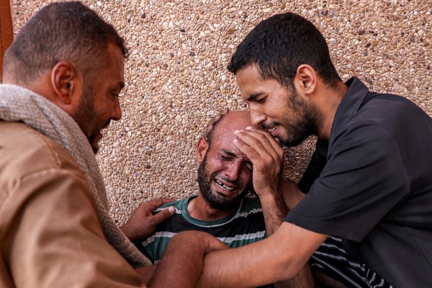 A Palestinian man mourning his son who was killed in Israeli bombardment in the southern Gaza Strip