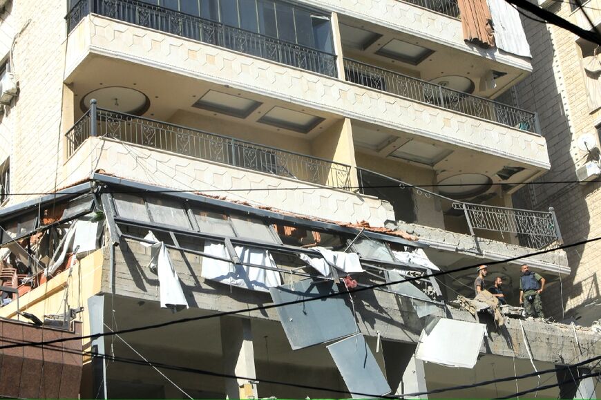 The missile strike hit an apartment in a 10-storey building in the densely populated southern suburbs, a Hezbollah stronghold