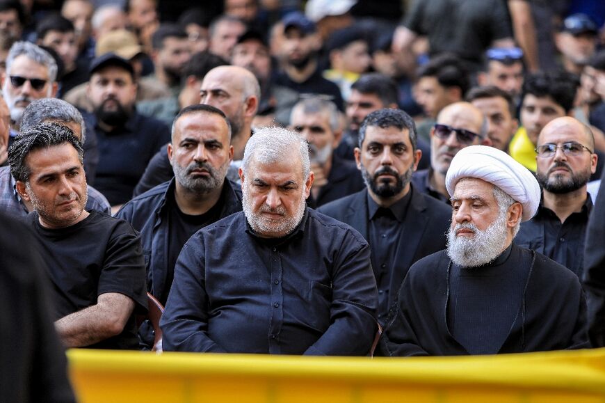 Hezbollah number two Naim Qassem (R) and Mohammed Raad (C), head of the Hezbollah bloc in Lebanon's parliament, at the funeral of Radwan Force chief Ibrahim Aqil