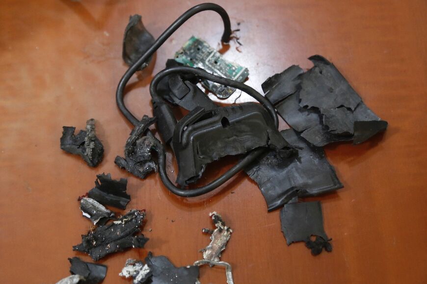 The remains of exploded Hezbollah pagers are put on display at an undisclosed location in Beirut's southern suburbs, a stronghold of the militant group