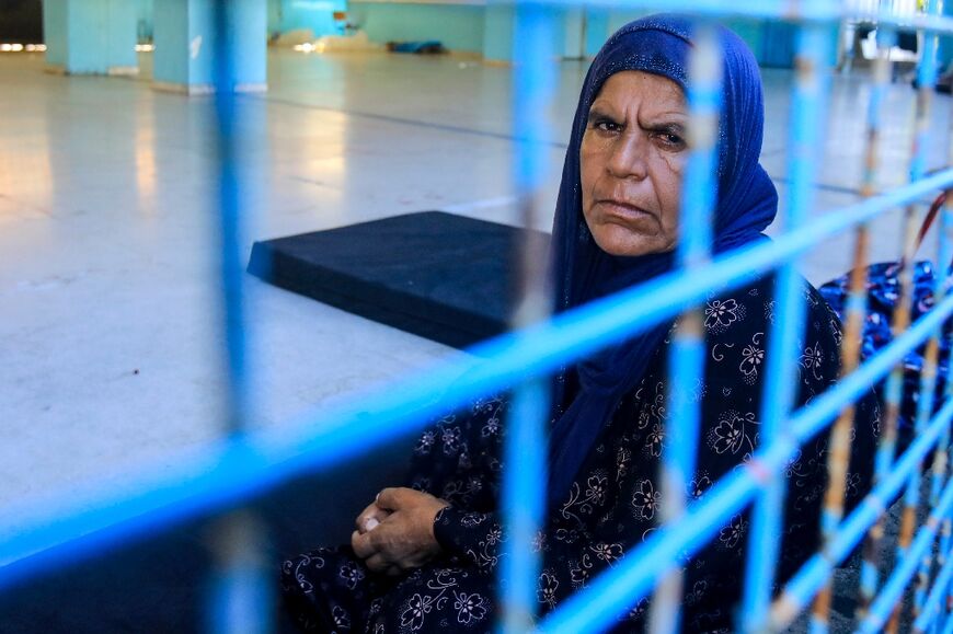 A displaced Lebanese woman is seen at a school-turned-shelter in Beirut