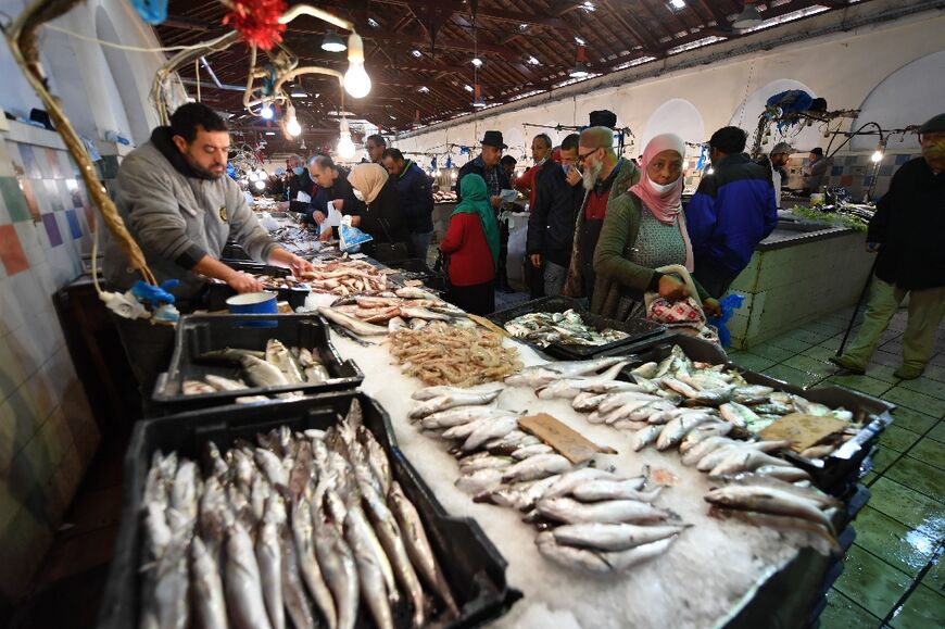 Tunisians shop at a fish market in the capital Tunis -- fish are a staple of Tunisian cuisine and a major export commodity