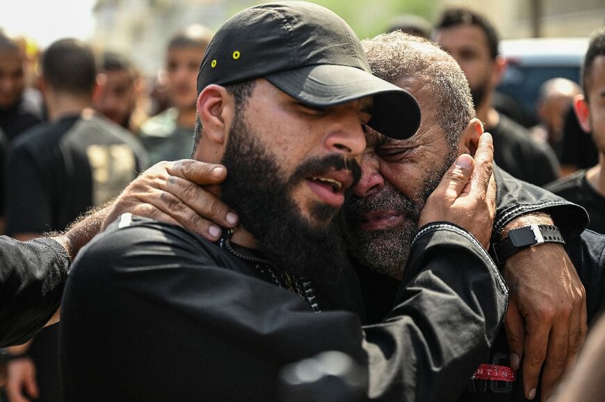 Mourners react during the funeral procession of Palestinians killed in an Israel raid on the northern part of occupied West Bank