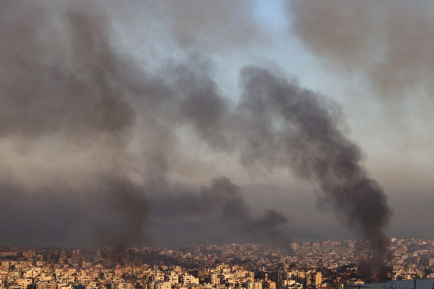 Plumes of smoke over Beirut's southern suburbs after the overnight bombardment