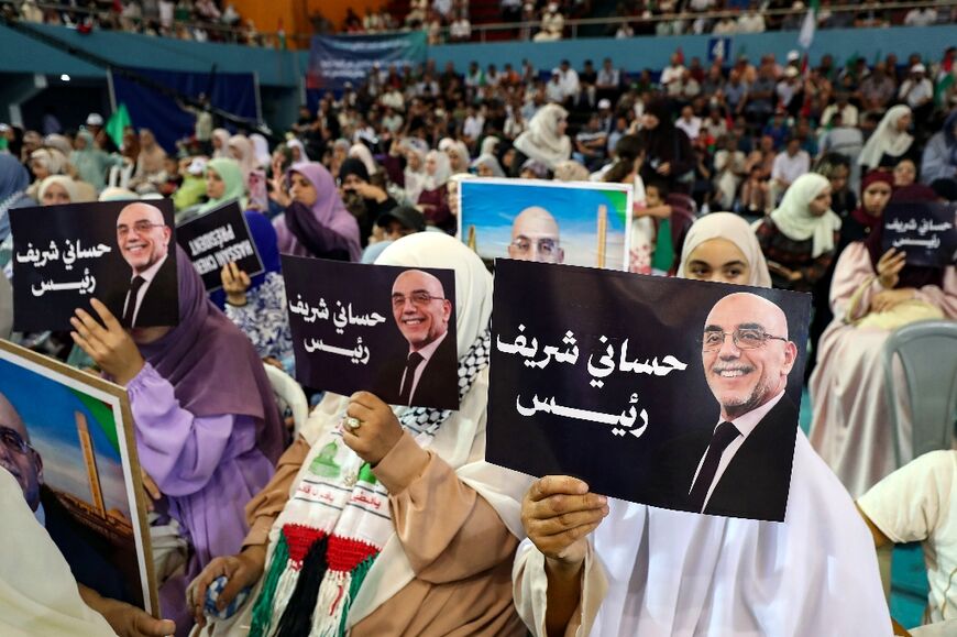 Supporters of moderate Islamist candidate Abdelaali Hassani Cherif, attend his electoral campaign in Algiers