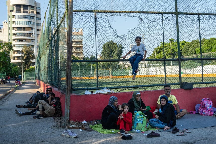 BEIRUT, LEBANON - SEPTEMBER 28: People sit in a sports club after being displaced by Israeli airstrikes on September 28, 2024 in Beirut, Lebanon. Last night and into the early hours of the morning, Israeli warplanes struck several buildings in Beirut's southern suburbs as it targeted what it said were Hezbollah facilities. (Photo by Carl Court/Getty Images)