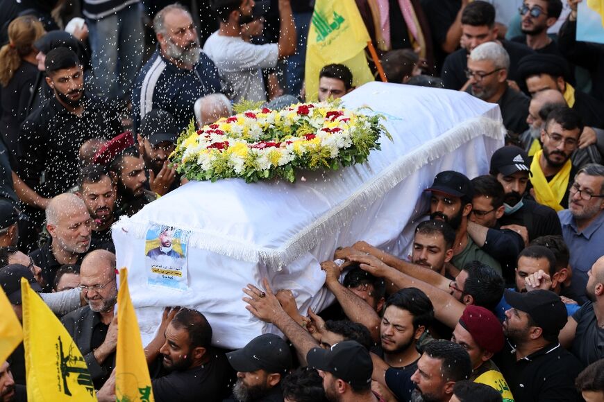 Mourners in Beirut pay respects to a person killed when hundreds of paging devices exploded across Lebanon the day before