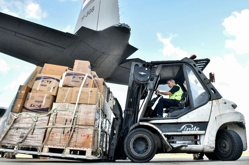 A shipment of emergency medical aid provided by Iraq is unloaded at Beirut International Airport