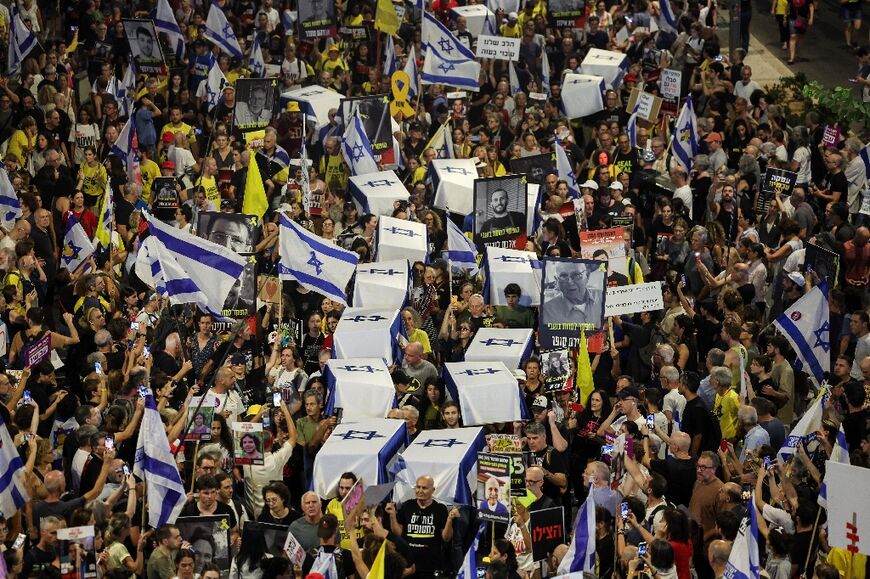 Demonstrators in Tel Aviv carry symbolic coffins during a protest on September 5, 2024 calling for action to secure the release of Israeli hostages in Gaza 