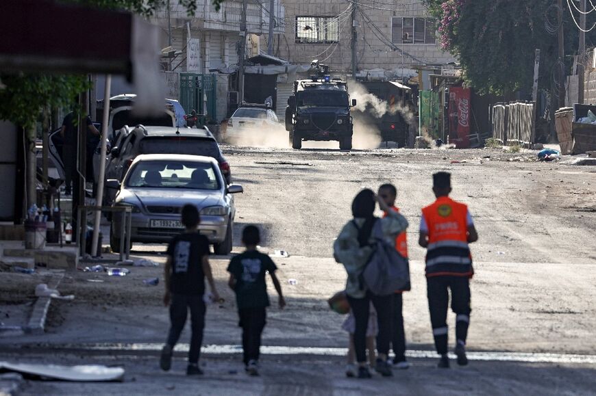 Israeli armoured vehicles block a road leading to a hospital in Jenin in the occupied West Bank, during a multi-day raid