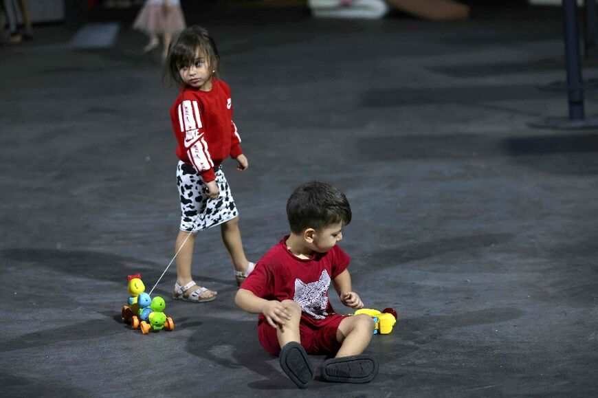 Displaced children have turned the venue's dancefloor into a makeshift play area