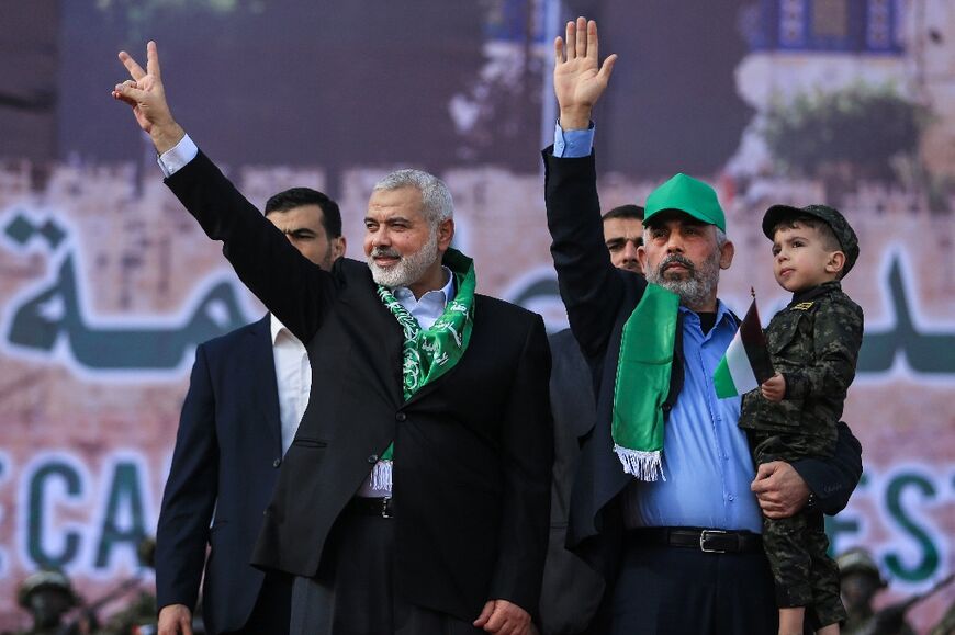 Hamas's Ismail Haniyeh (L) and Yahya Sinwar at a rally in Gaza City, in 2017