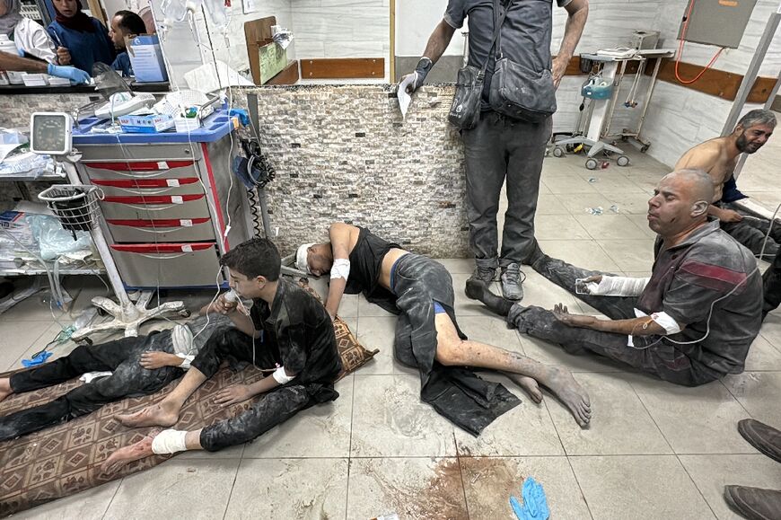 Wounded Palestinians receive treatment at Kamal Adwan Hospital after an Israeli air strike in Beit Lahia, northern Gaza