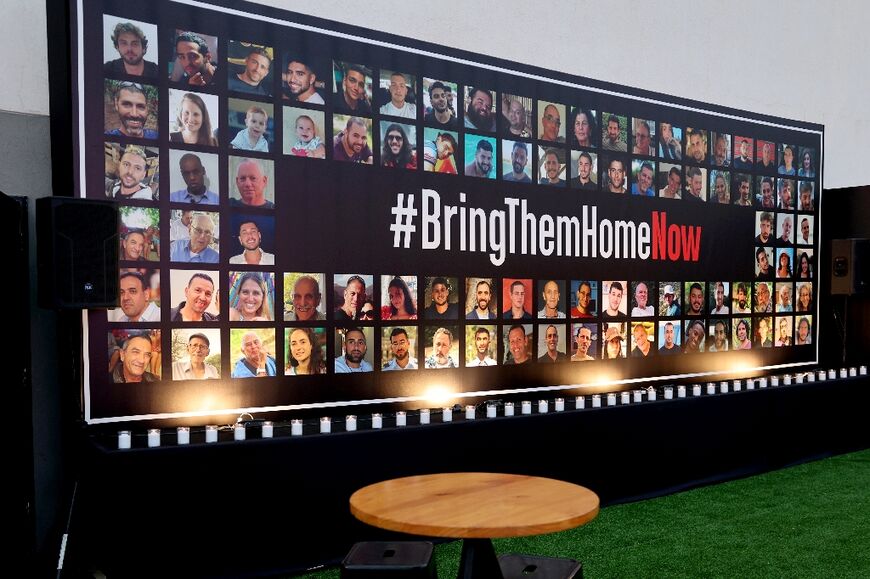 Portraits of hostages taken on October 7 are displayed at a memorial for the victims killed at or kidnapped from the Nova music festival during the attack