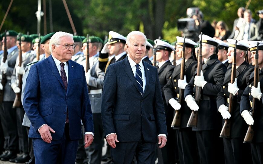 US President Joe Biden and German counterpart Frank-Walter Steinmeier review a military honour guard during an official welcoming ceremony at in Berlin