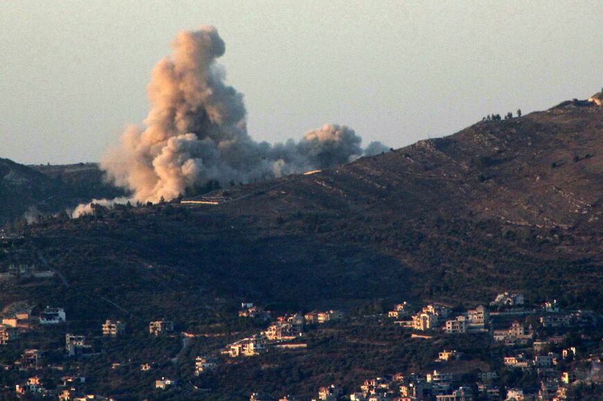 Smoke rises over the southern Lebanese border village of Odaisseh during an Israeli strike