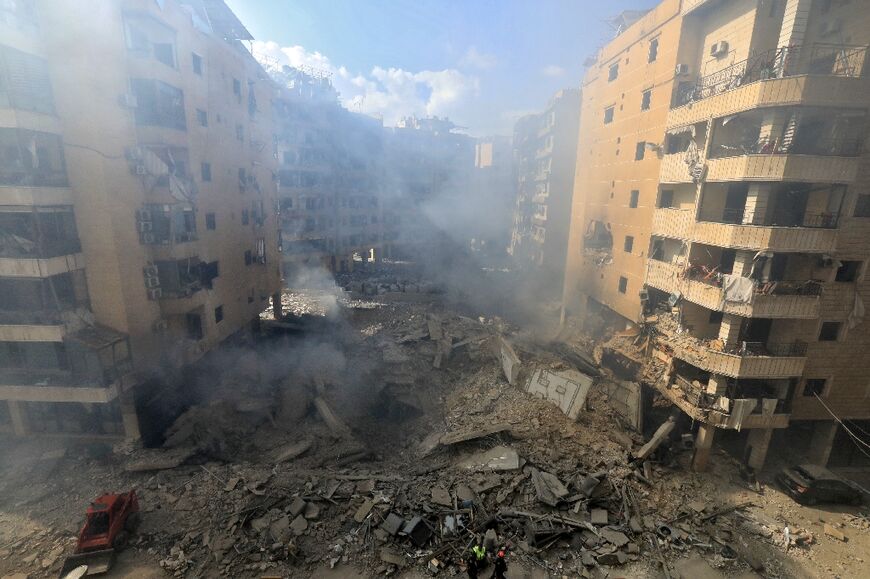 Rescuers were still combing the wreckage in the densley packed neighbourhoods known in Arabic as Dahiyeh