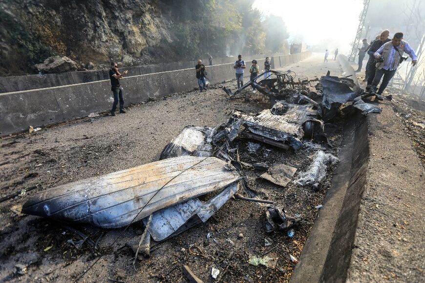 A vehicle wrecked by an Israeli strike on a Hezbollah van carrying munitions near Beirut