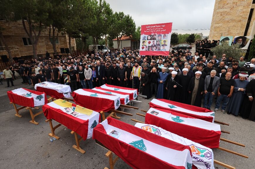 Mourners attend a funeral for the victims of an Israeli air strike in the Lebanese village of Maaysra, east of the coastal town of Byblos