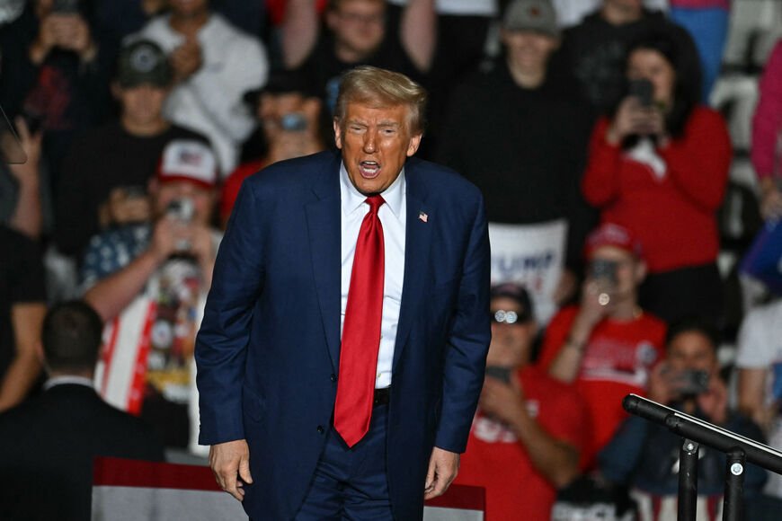 Former US President and Republican presidential candidate Donald Trump shouts to the crowd as he concludes his remarks during a campaign rally at the Ryder Center for Health and Physical Education at Saginaw Valley State University in Saginaw, Michigan, October 3, 2024. (Photo by Jim WATSON / AFP) (Photo by JIM WATSON/AFP via Getty Images)