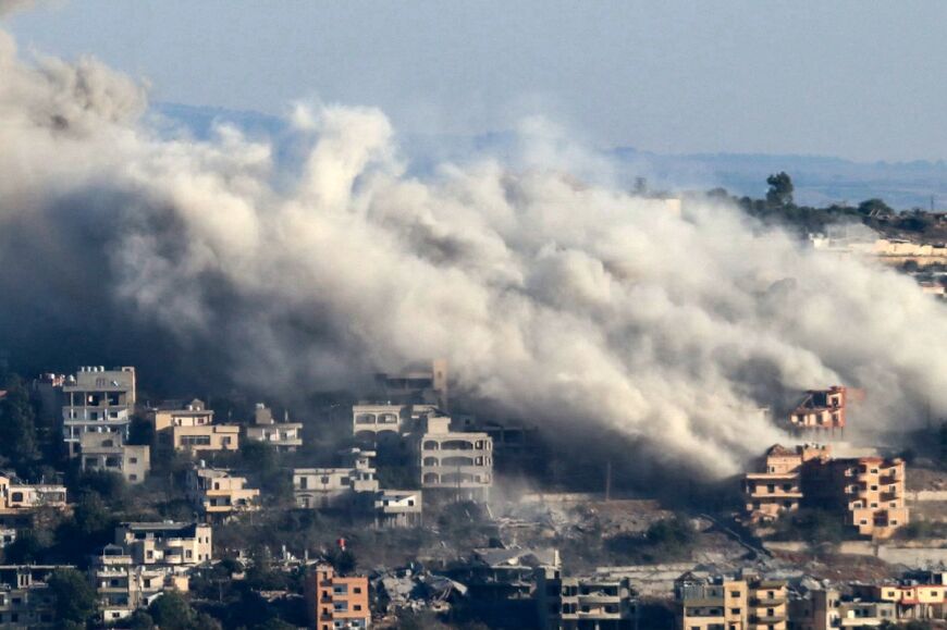 Smoke rises from the site of an Israeli air strike that targeted the southern Lebanese border village of Khiam 