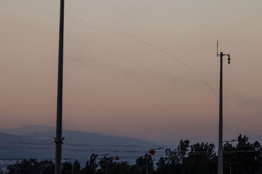 A rocket fired from southern Lebanon is intercepted by Israel's air defence system over the Upper Galilee region in northern Israel