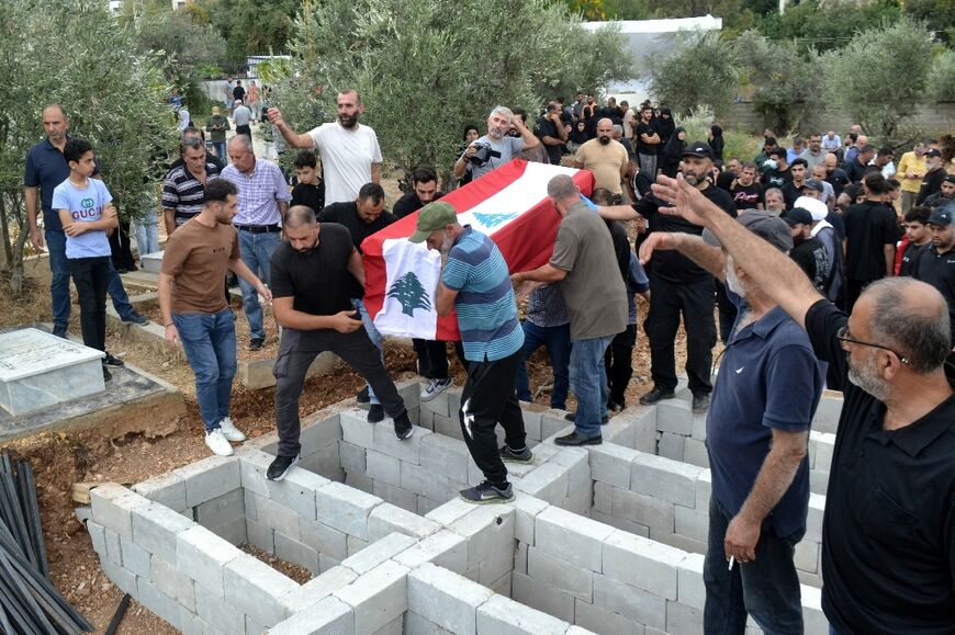 Mourners carry the coffin of someone killed in an Israeli strike in Lebanon's Koura district