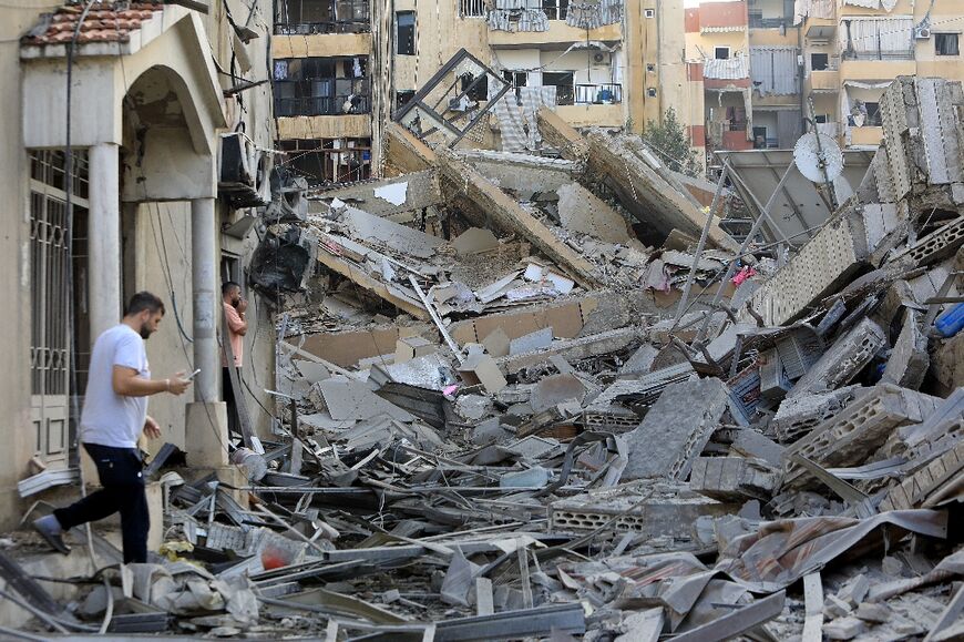 A man walks amid the devastation after an Israeli strike on the Sfeir neighbourhood in Beirut’s southern suburbs 