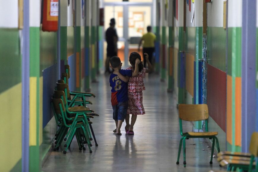 Children in the corridor of a Beirut school housing families displaced from south Lebanon