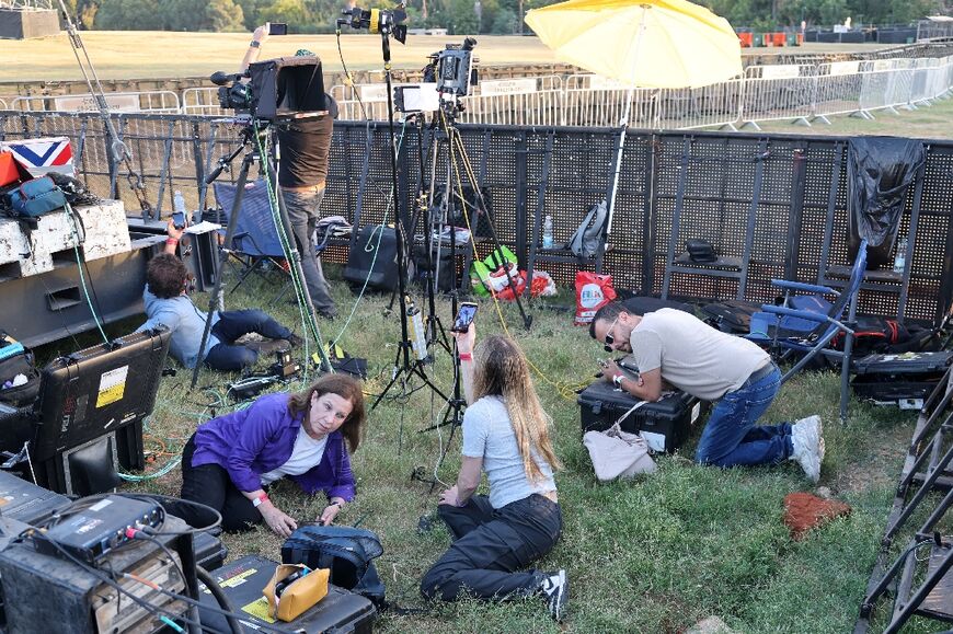 Journalists in the Tel Aviv park to cover the ceremony took cover as sirens sounded to warn of incoming rockets