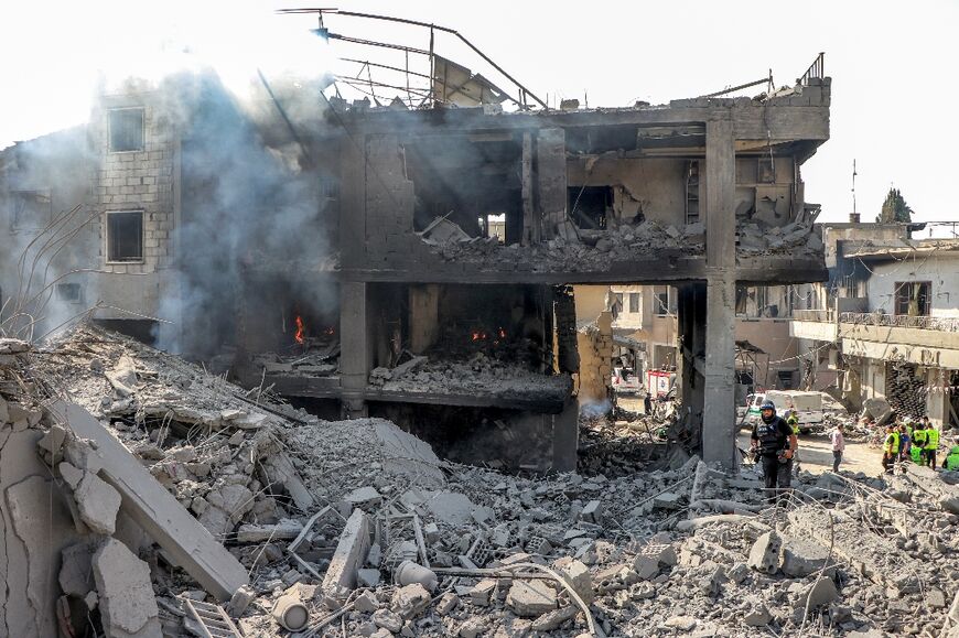 The rubble of a building destroyed by Israeli air strike on the village of Qana in southern Lebanon 