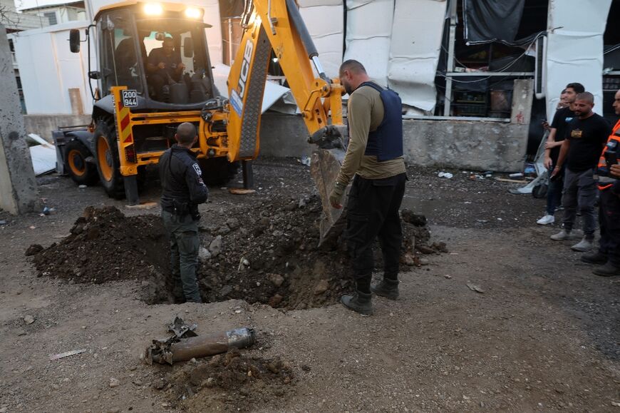 The remains of a projectile in the town of Majd al-Krum in northern Israel, after Israel said two people were killed by a Hezbollah rocket