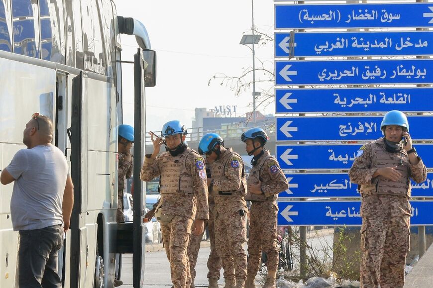 Members of the UNIFIL peacekeeping force at the scene of the strike