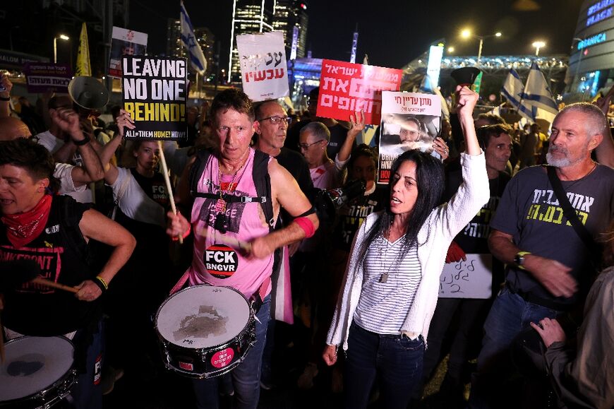 Israelis demanding the return of Gaza hostages block a road in Tel Aviv after Gallant was dismissed