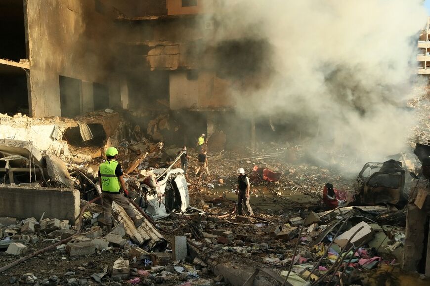 Rescuers search for survivors at the site of an Israeli airstrike in the southern Lebanese city of Nabatieh on November 16, 2024