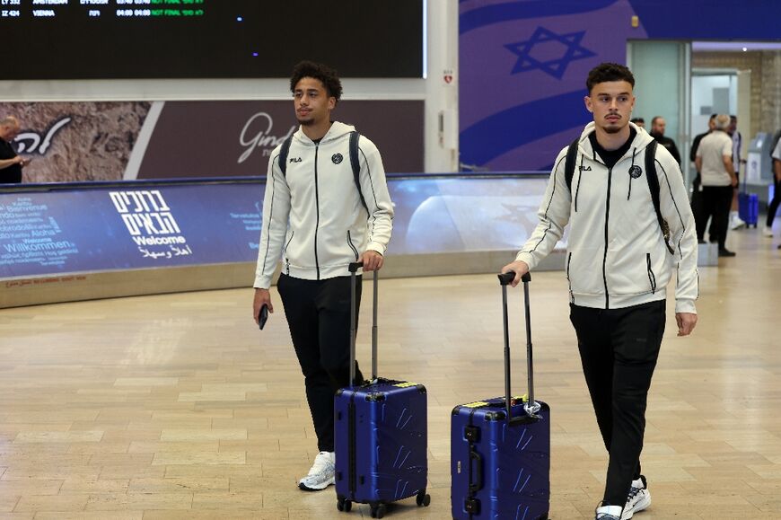 Players of Maccabi Tel Aviv arrive home after their Europa League game in Amsterdam was marred by violence condemned as 'anti-Semitic'