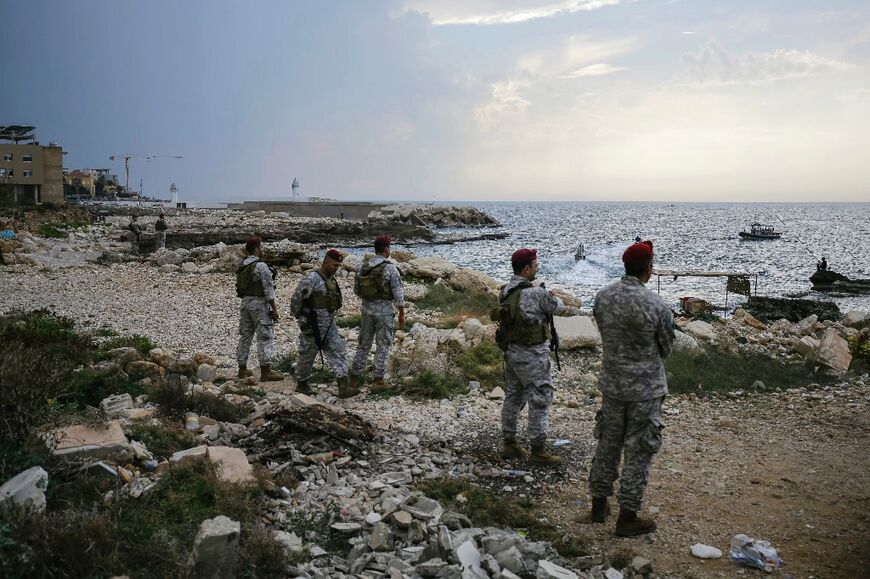 Lebanese soldiers inspect the beach where Israeli naval commandos are believed to have landed on Friday